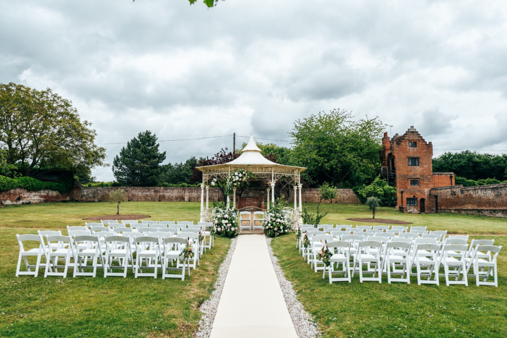 Outdoor wedding ceremony at Seckford Hall