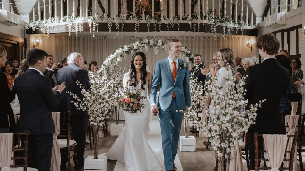 bride and groom in the great hall at seckford hall